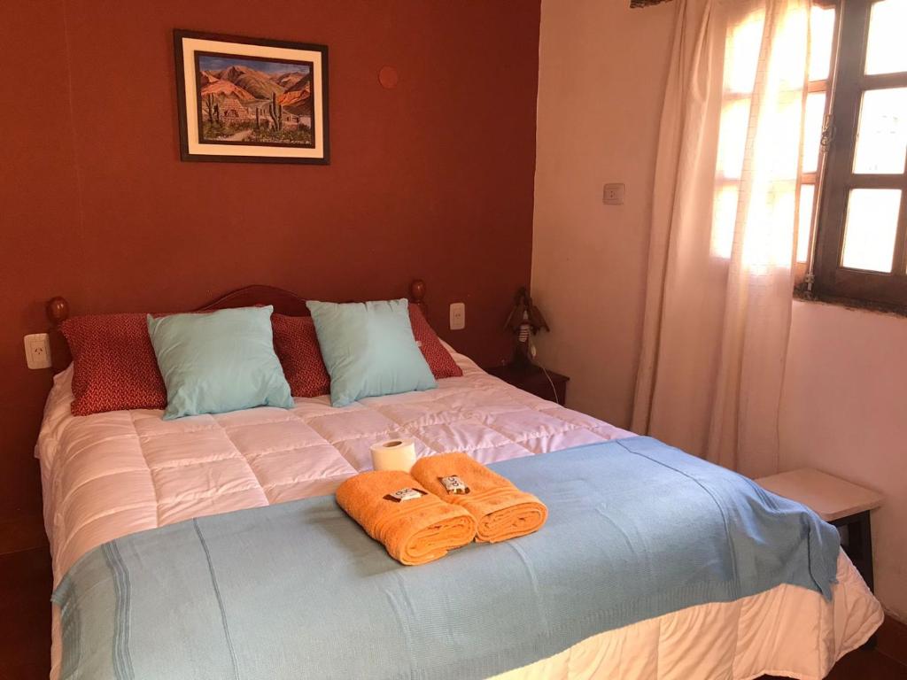 En eller flere senge i et værelse på Posada LO DE ELIAS