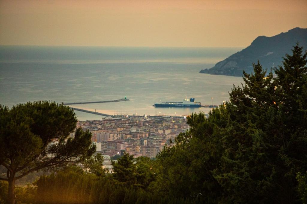 a view of a city with a ship in the water at B&B Villa Setharè in Salerno