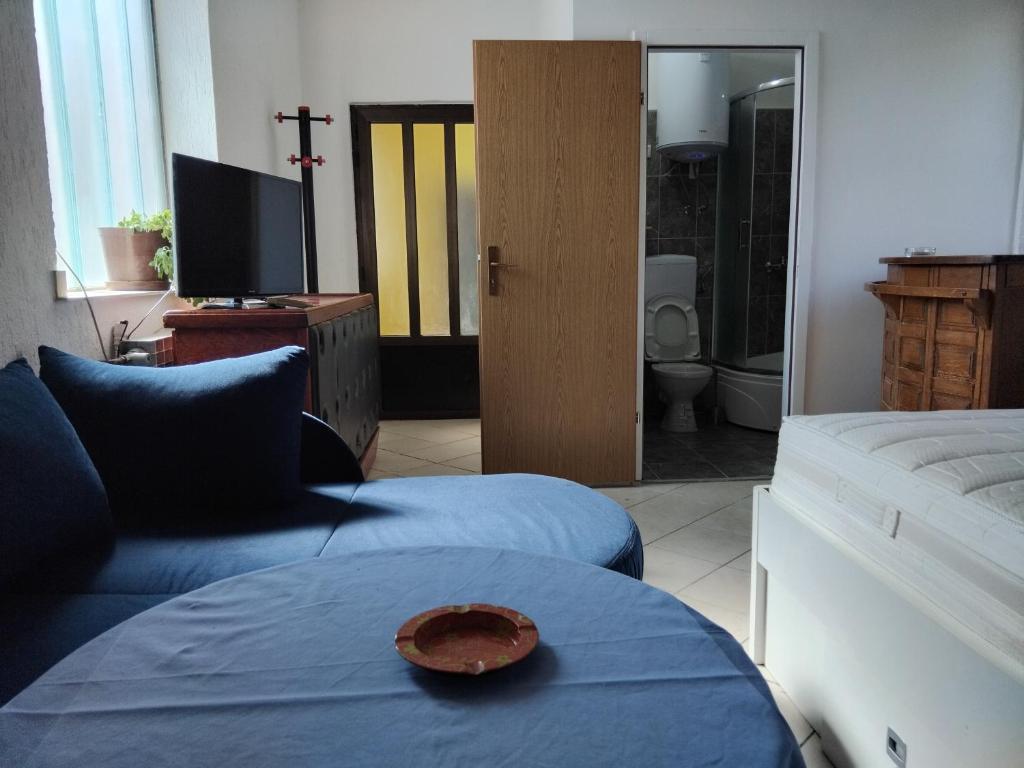 a living room with a plate on a table at Apartman Buco in Livno