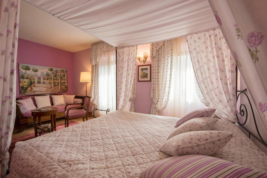 Posteľ alebo postele v izbe v ubytovaní Relais Osteria Dell'Orcia