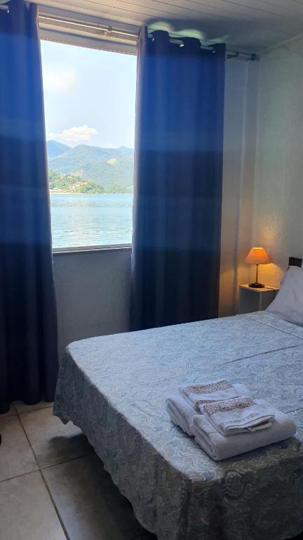 En eller flere senge i et værelse på Bela vista