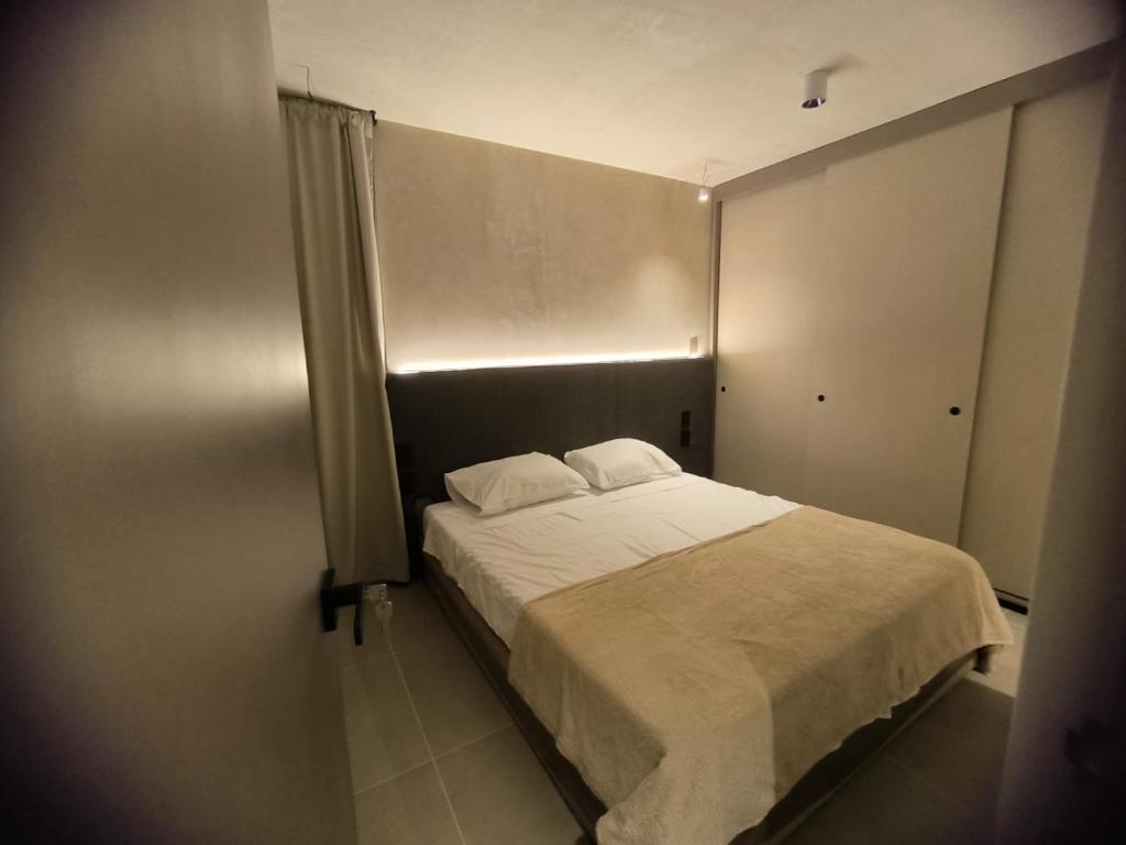 En eller flere senge i et værelse på Apartamento minimalista norte armenia