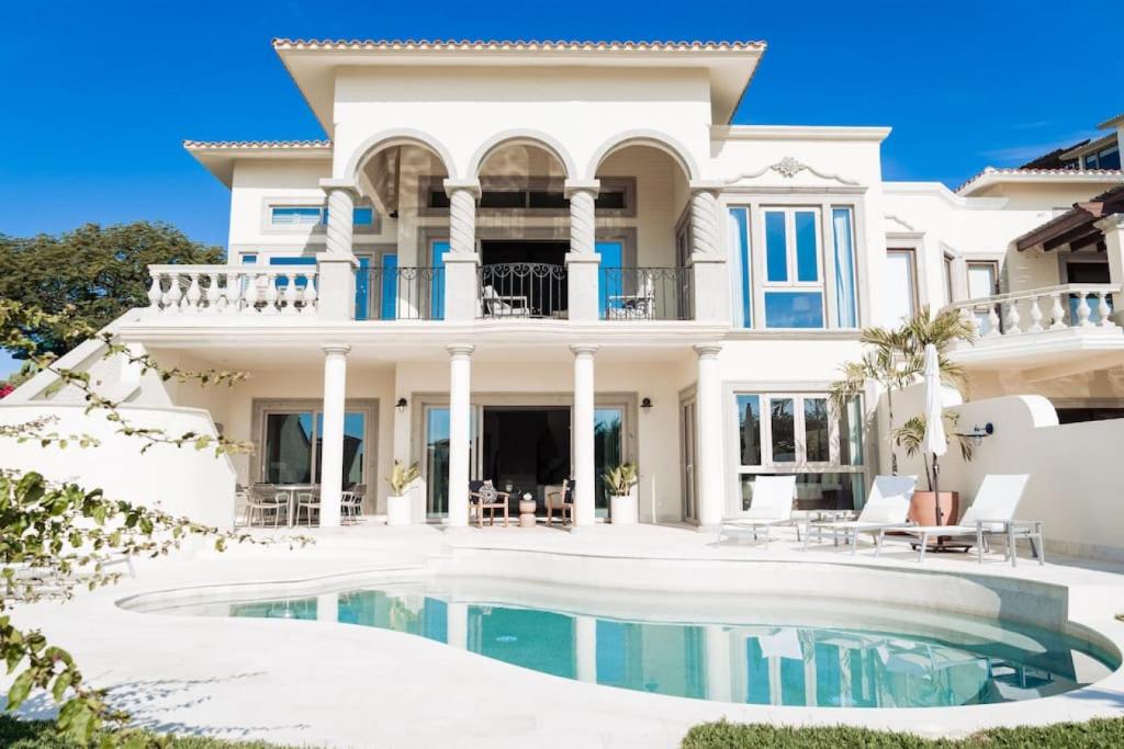 a house with a swimming pool in front of it at Luxury Villa Retreat, Pool in Cabo San Lucas