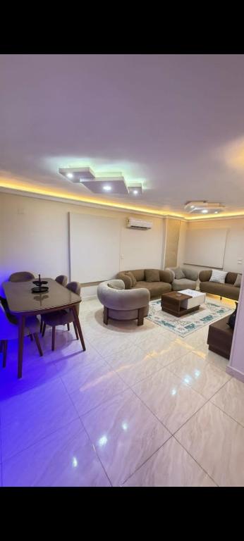 a living room with a couch and a table at عماره 11 in 6th Of October