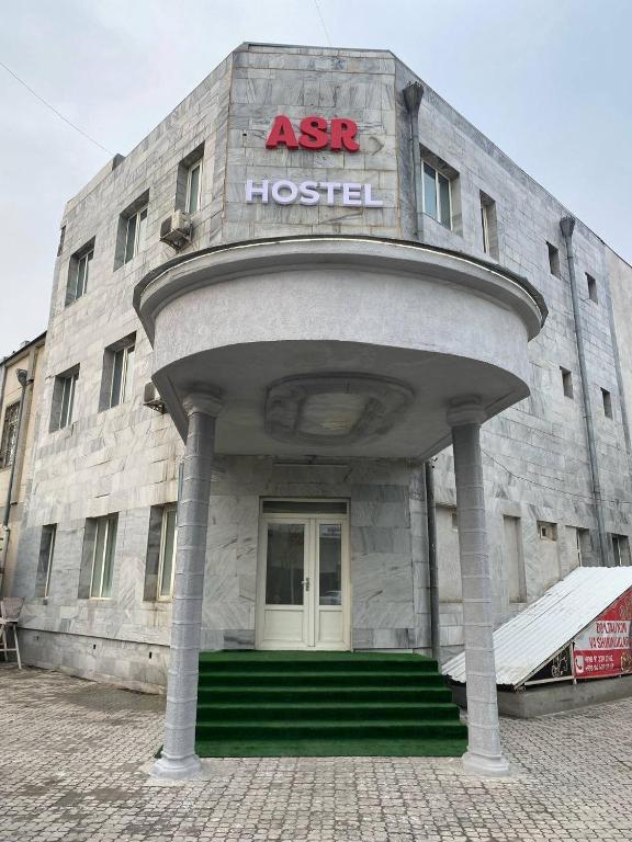 a building with an asx hospital sign on it at ASR HOSTEl in Andizhan
