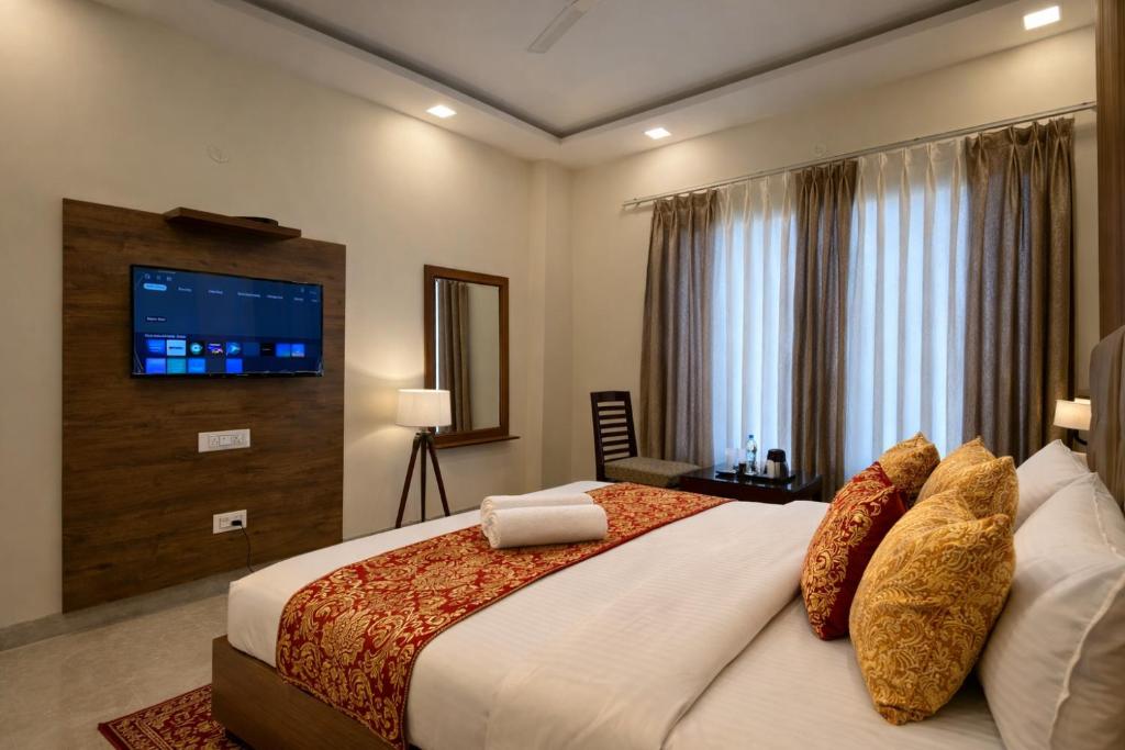 En eller flere senge i et værelse på Hotel Wood Lark by Sidham Group # Budget Friendly