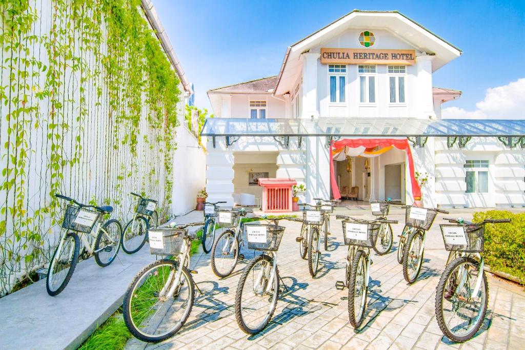 a group of bikes parked in front of a building at Chulia Heritage Hotel in George Town