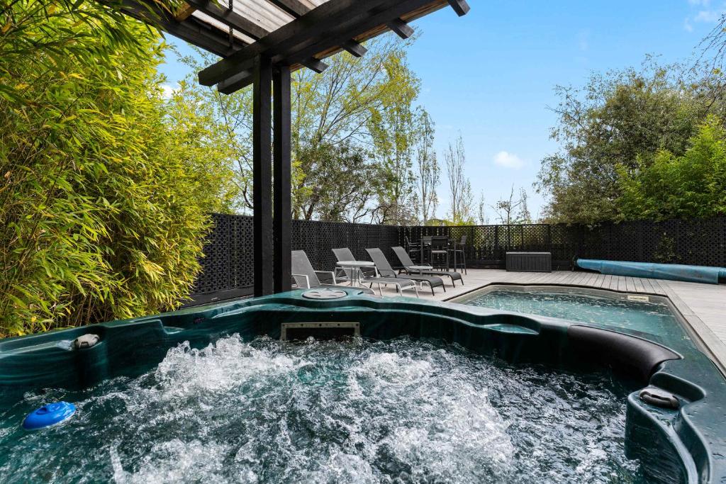 a pool with a water slide in a backyard at 2BR plus Studio Pool & Spa Sleeps 8 in Daylesford