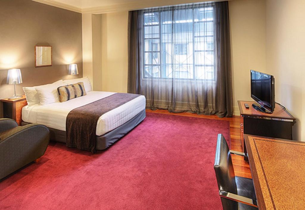 Ένα ή περισσότερα κρεβάτια σε δωμάτιο στο Rendezvous Heritage Hotel Auckland