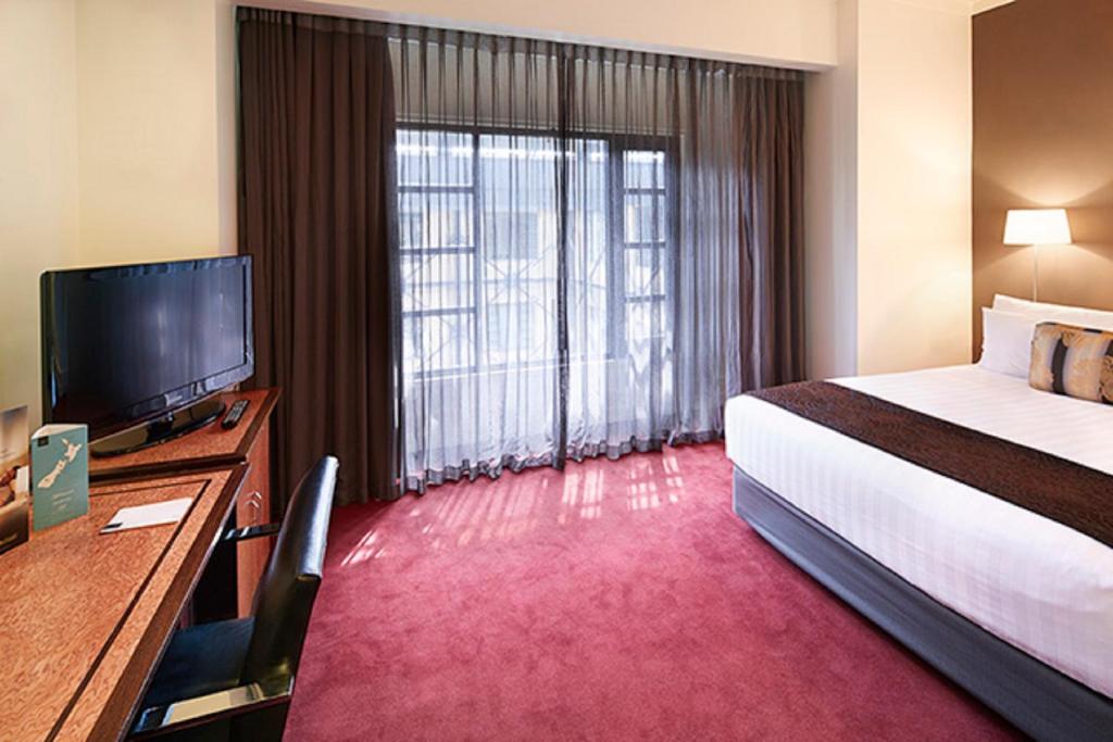 Ένα ή περισσότερα κρεβάτια σε δωμάτιο στο Rendezvous Heritage Hotel Auckland