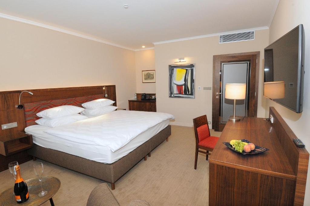Postel nebo postele na pokoji v ubytování Hotel Kramer