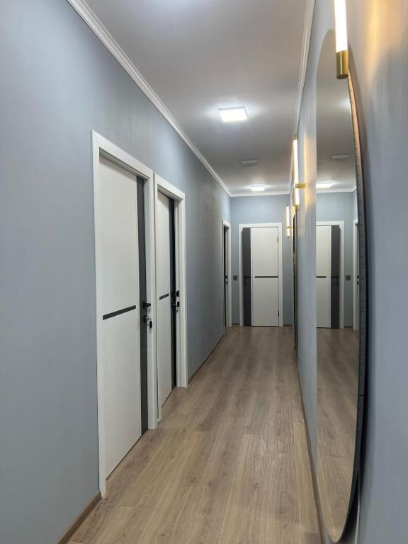an empty hallway with a mirror on the wall at Дачный дом in Balqash