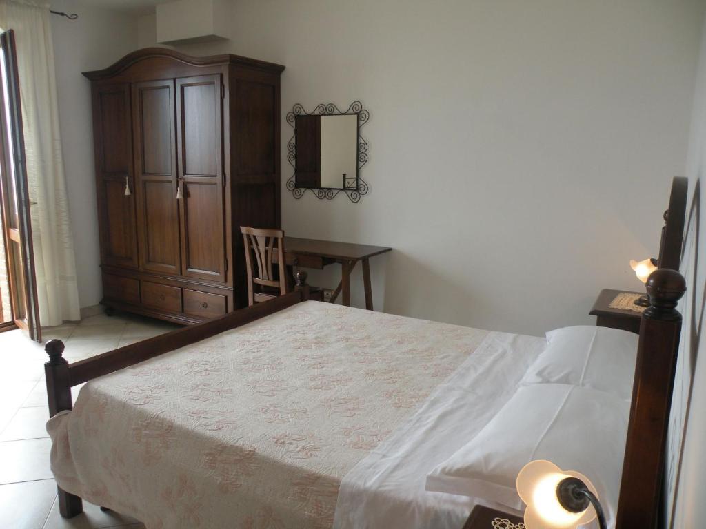 Postel nebo postele na pokoji v ubytování La Collina Del Sagrantino