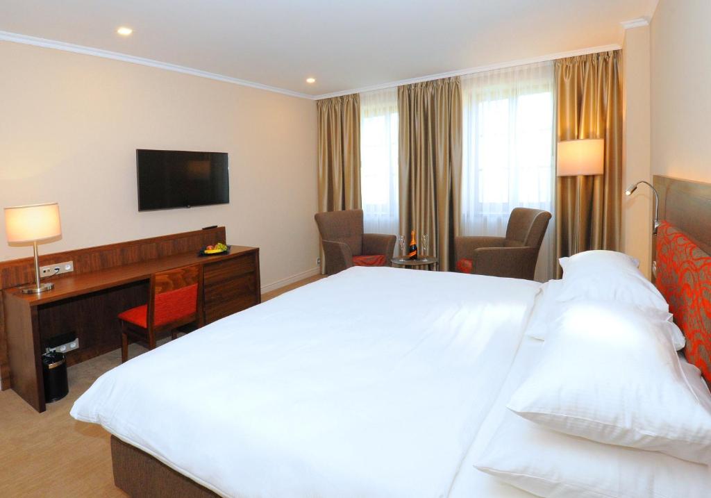 Postel nebo postele na pokoji v ubytování Hotel Kramer