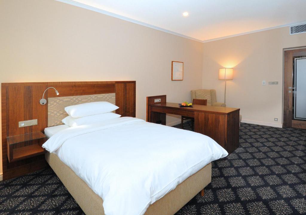 Postel nebo postele na pokoji v ubytování Hotel Kramer