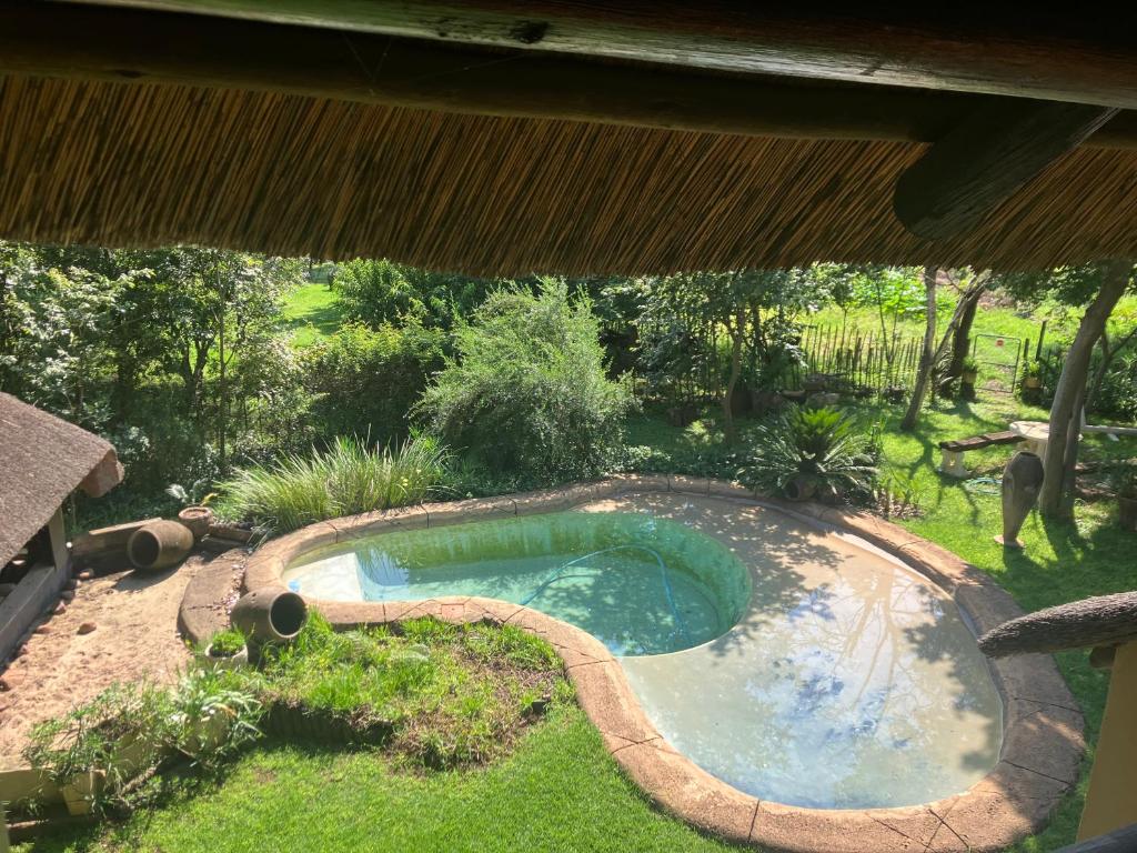 an overhead view of a small pool in a yard at Cave view Cottages in Muldersdrift