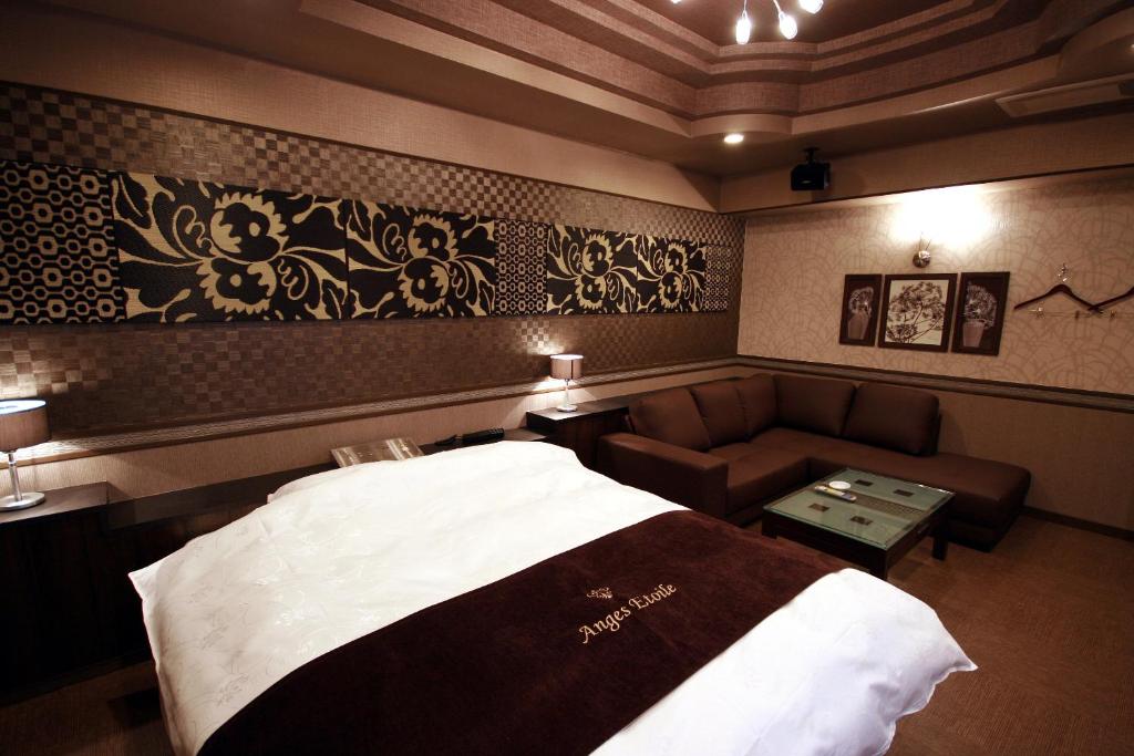 Postel nebo postele na pokoji v ubytování ホテル アンジュエトワール 堺 - Adult Only