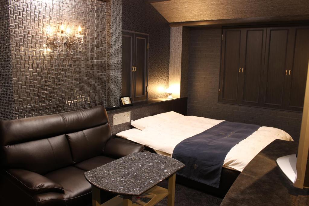 Postel nebo postele na pokoji v ubytování ホテル アンジュエトワール 堺 - Adult Only