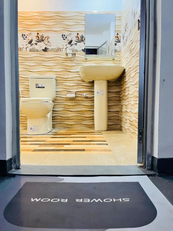a view of a bathroom with a sink and a toilet at Azure Coast Villa in Ahangama