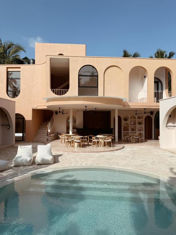 a house with a swimming pool in front of it at Together Boutique Villa in Ahangama