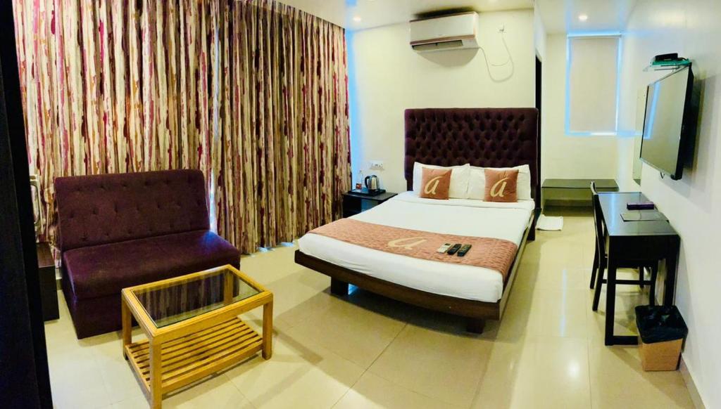 En eller flere senge i et værelse på Astra Hotels & Suites - HSR Layout Sector 1, Near Ecospace Bellandur