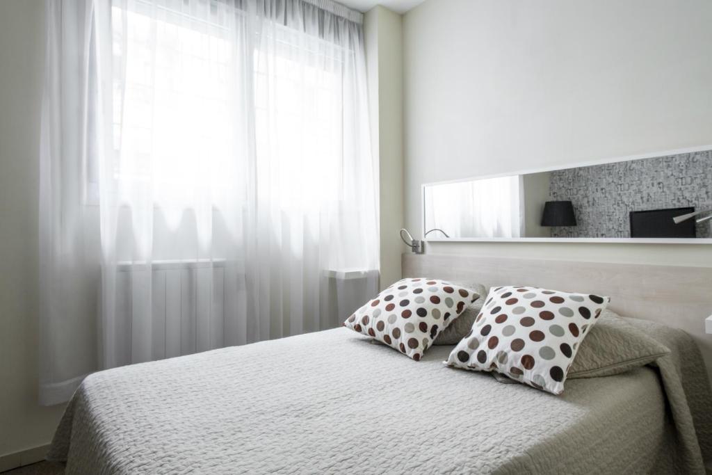 Postel nebo postele na pokoji v ubytování Residencia Universitaria Resa Blas De Otero