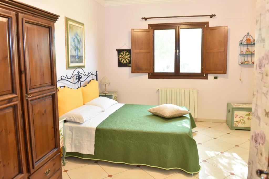 Łóżko lub łóżka w pokoju w obiekcie B&B Villa Anastasia Club