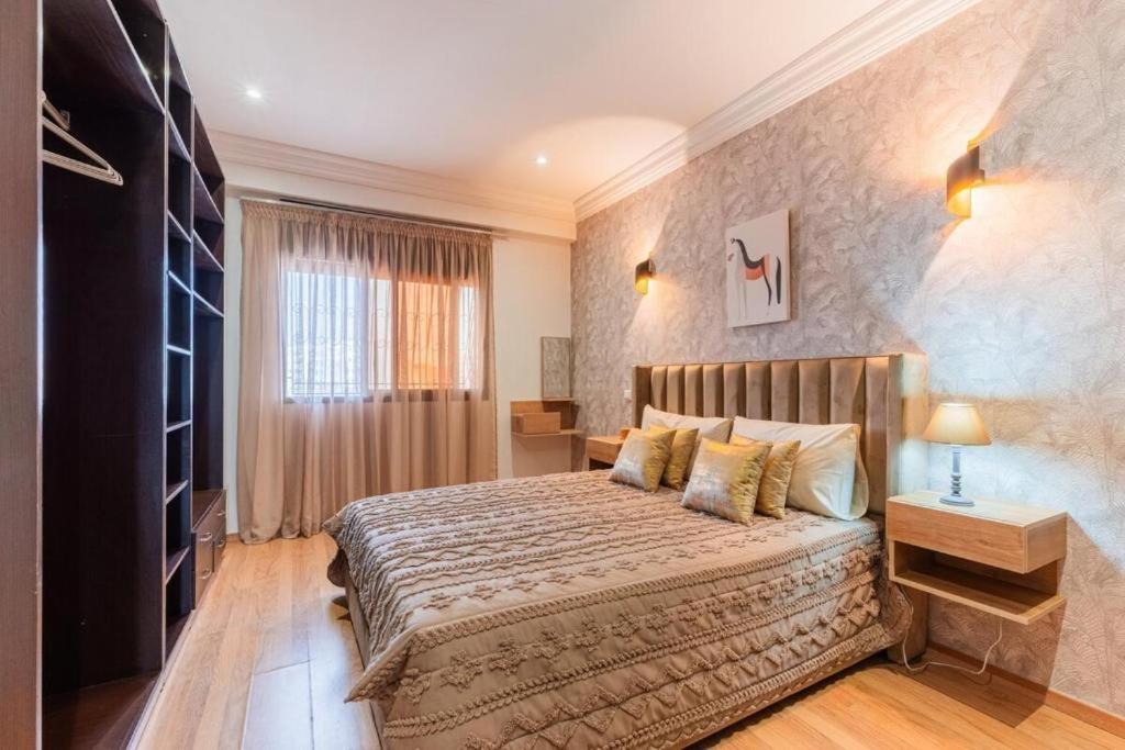 Giường trong phòng chung tại Appartement Cosy et central