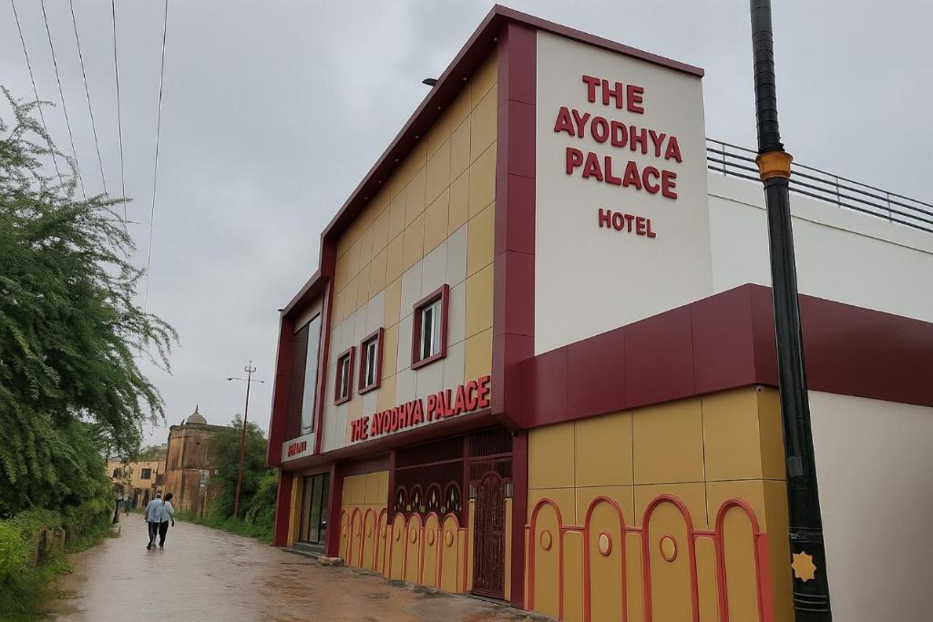 a man walking down a street in front of a building at Hotel The Ayodhya Ji Palace-Walking Distance From Ram Mandir in Ayodhya