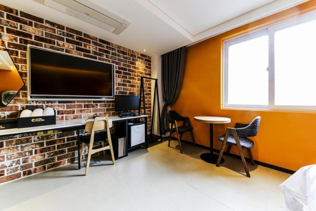 TV a/nebo společenská místnost v ubytování Hotel Cacao