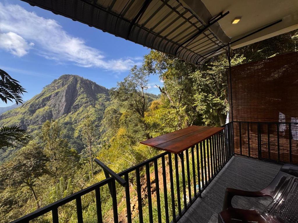 a balcony with a view of a mountain at Green Mount Eye Ella in Ella