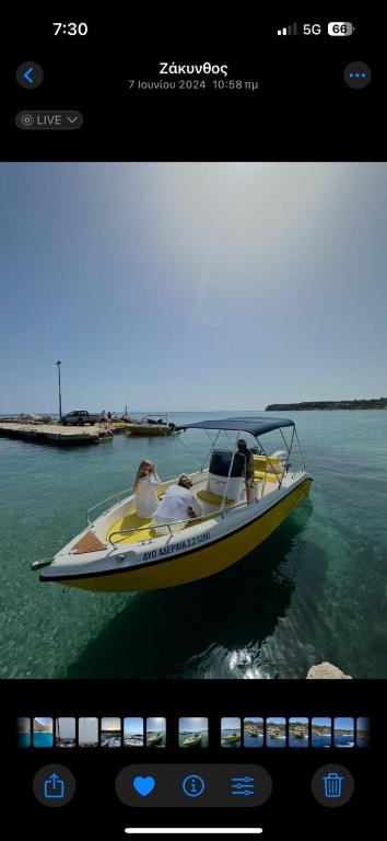 a boat on the water with people in it at Tsilivi Yellow Boats in Zakynthos