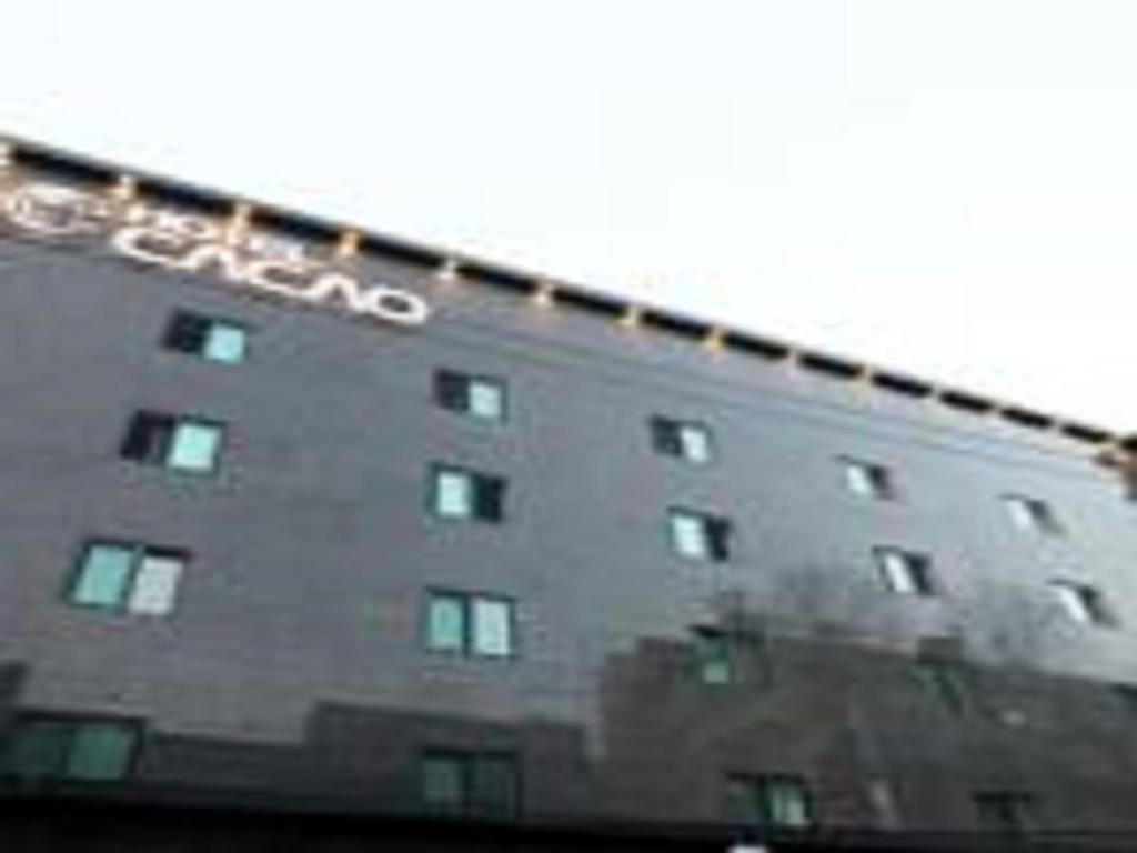 a building with a sign on the side of it at Hotel Cacao in Incheon