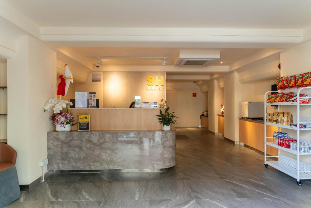 a lobby of a store with a counter and a counter sidx sidx sidx at SH Hotel in Phnom Penh