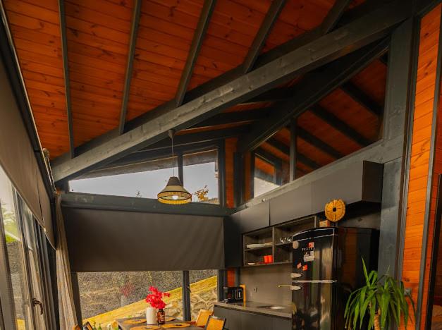 a large kitchen with a large window and a ceiling at Palmera suit in Sapanca