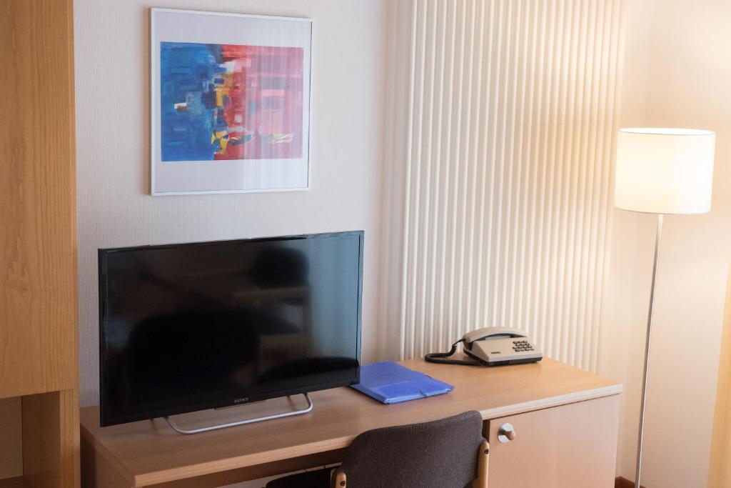 TV a/nebo společenská místnost v ubytování Blümlisalp