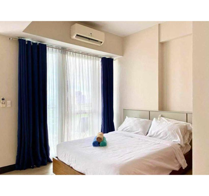 En eller flere senge i et værelse på Rk Property Rentals