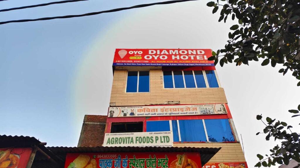 a building with a sign on the top of it at SPOT ON Diamond Hotel in Rāmpura