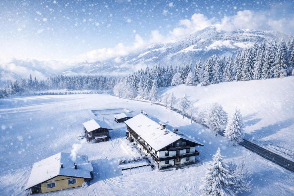 an aerial view of a house in the snow at Berghütte Burgweghof Jugendgästehaus in Westendorf