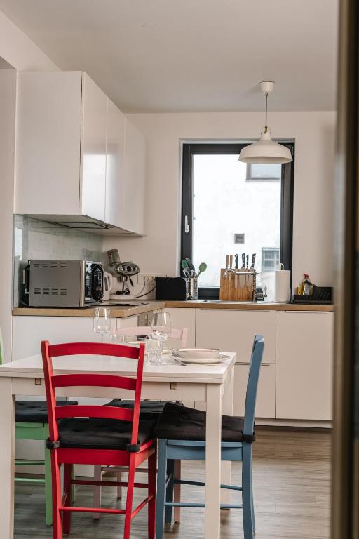 a kitchen with a table and two chairs at Apartma Dreamscape in Radovljica