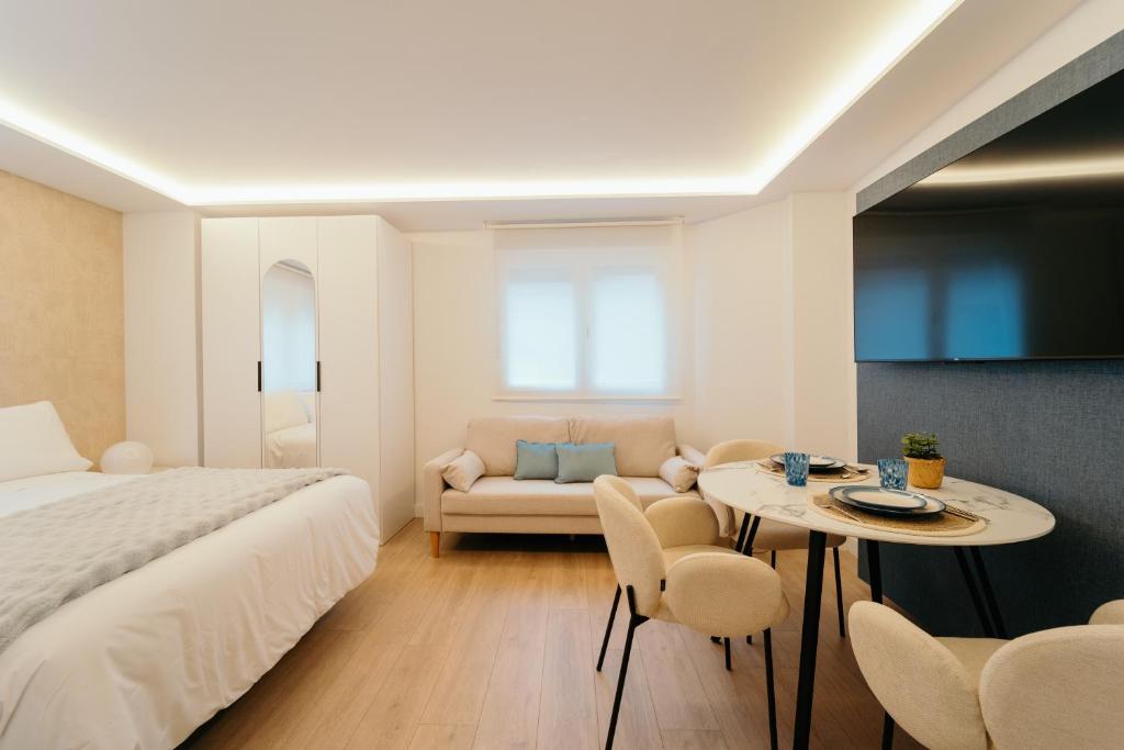 En eller flere senge i et værelse på Fuente H2