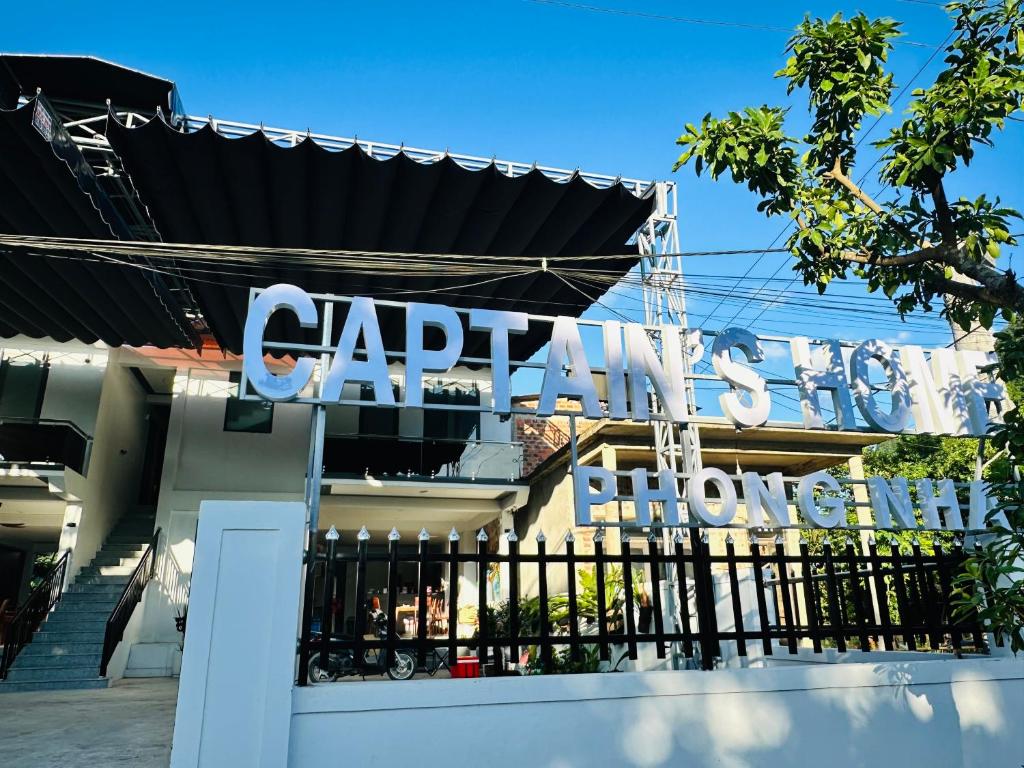 a sign on the side of a building at Captain's Home Phong Nha in Phong Nha
