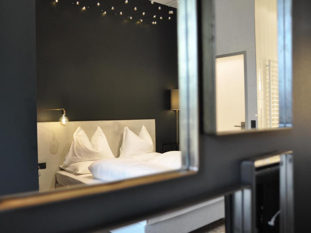 Postel nebo postele na pokoji v ubytování grätzlhotel Schönbrunn
