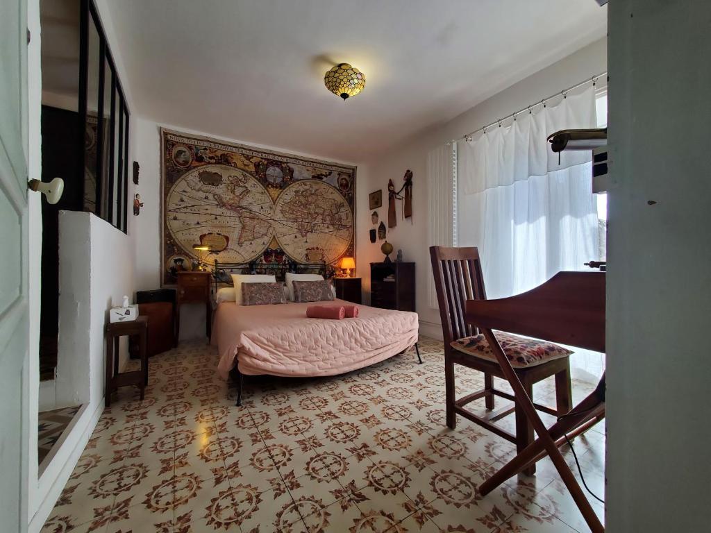 Postel nebo postele na pokoji v ubytování La Dolce Vita - Chambre Marco Polo