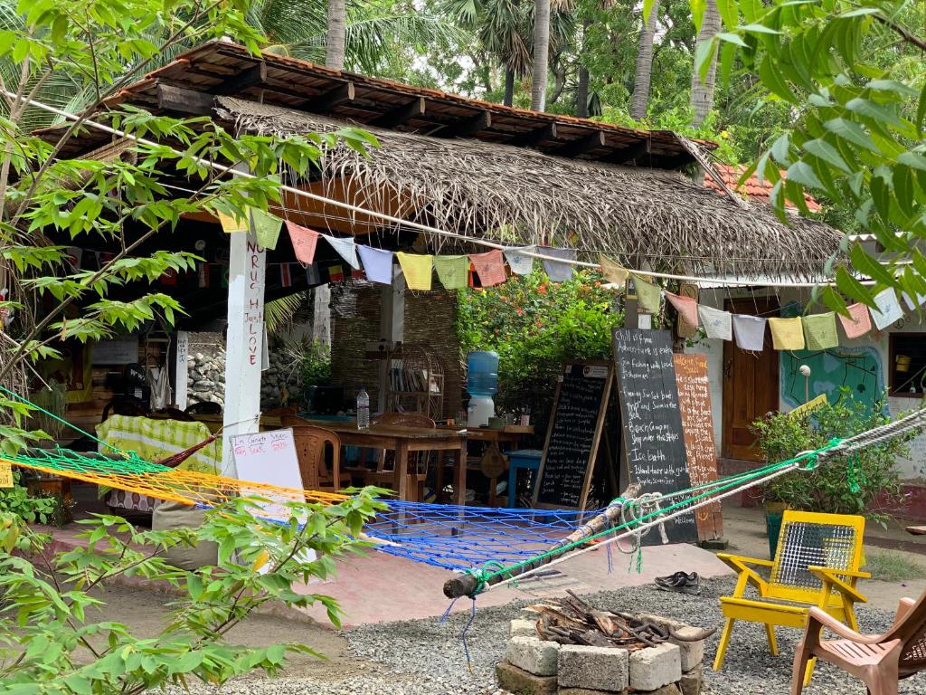 a small building with a sign in front of it at Delft Village stay in Delft East