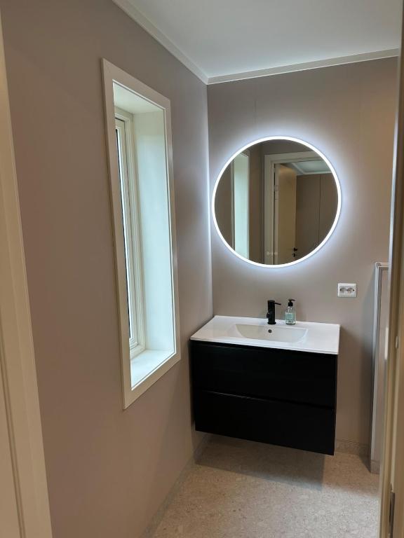 a bathroom with a sink and a mirror at New studio centrally located in Leknes in Leknes
