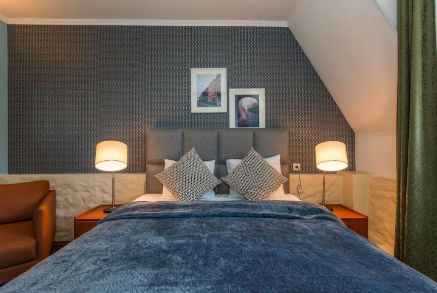 Postel nebo postele na pokoji v ubytování Tallinn City Apartments Residence