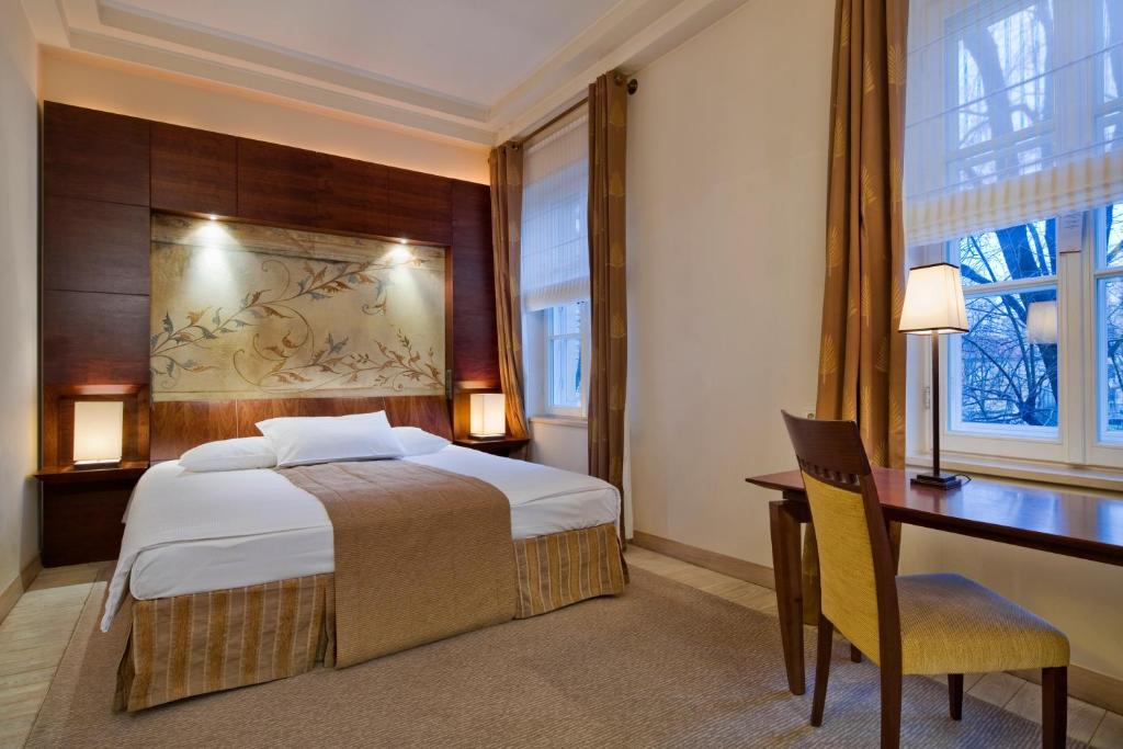 Postel nebo postele na pokoji v ubytování Mamaison Le Regina Boutique Hotel