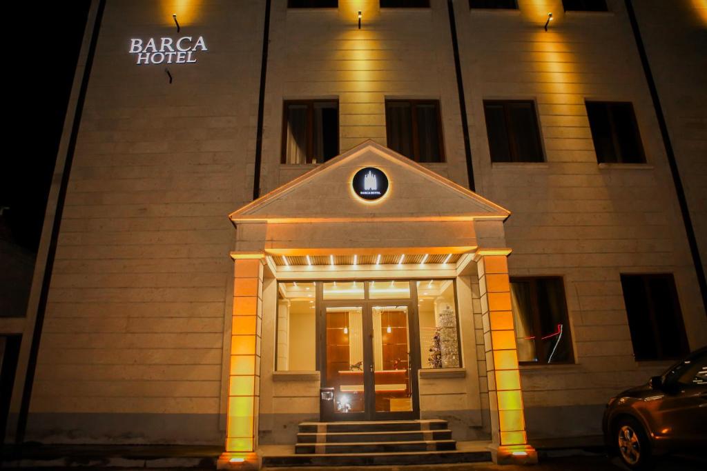 a facade of a hotel at night at Barca Hotel in Yerevan