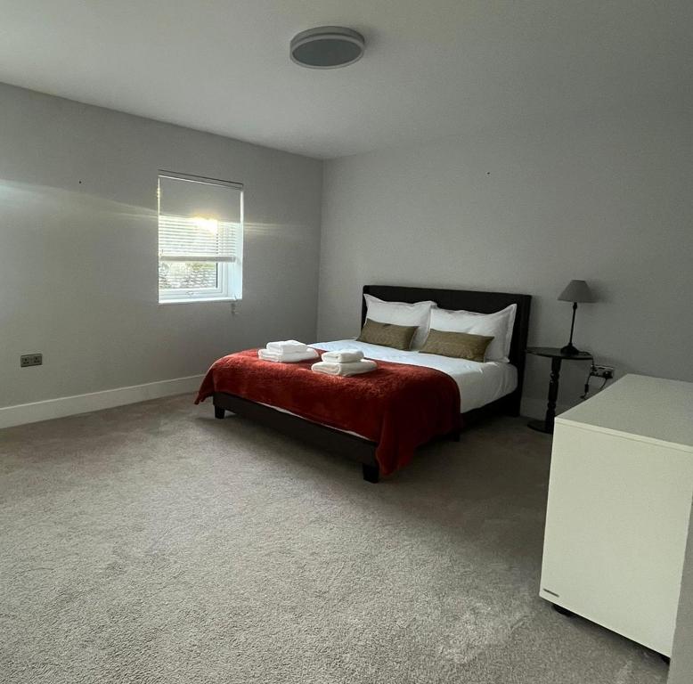 En eller flere senge i et værelse på The Minimalist's Retreat Oxford